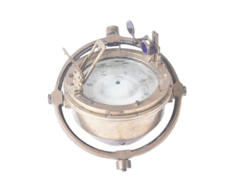 A vintage maritime interest ships floating magnetic compass / gimbal. Heavy brass construction mounted within the original ci