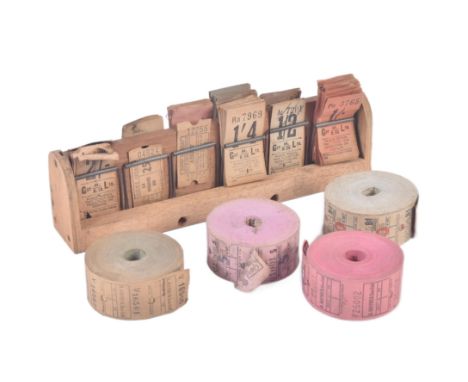 A collection of early 20th Century vintage coach / bus tickets&nbsp;together with a wooden spring mounted ticket holder and x