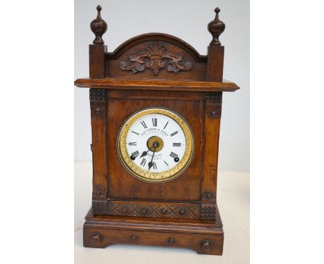 Oak cased mantle clock Fattorini & sons 8 day movement with alarm c1890/1900 currently ticking Height 44 cm 