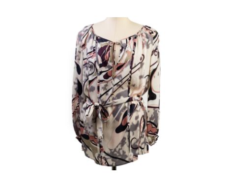 EMILIO PUCCI - A MAUVE DESIGN LONG SLEEVE BLOUSE
Donated Anonymously
Long sleeve blouse, designed with swirls of mauve, coral
