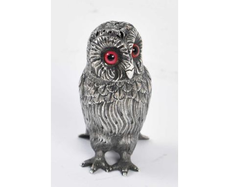 A Victorian hallmarked silver novelty pepper as an owl with glass eyes and pierced cover, London 1863, height 9cm, approx 3oz