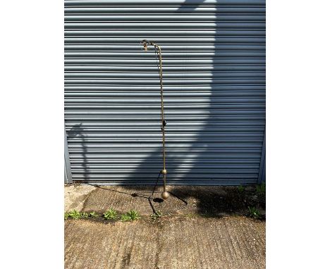A modern brass counterbalance standard lamp, height approx 180cm.