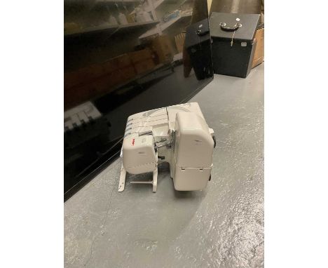 A Janome 9200D sewing machine.Condition Report: I'm afraid we cannot barenteenthqt this item is in full working order as it i