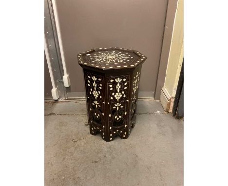 An Eastern carved hardwood and mother of pearl inlaid octagonal occasional table, height 50cm.