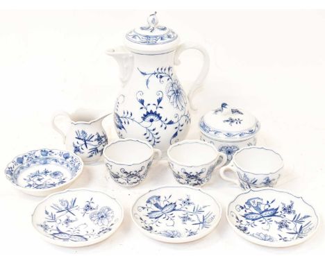 MEISSEN; a 20th century blue and white coffee pot, height 23cm, a set of three cups and saucers, sugar bowl with cover, cream