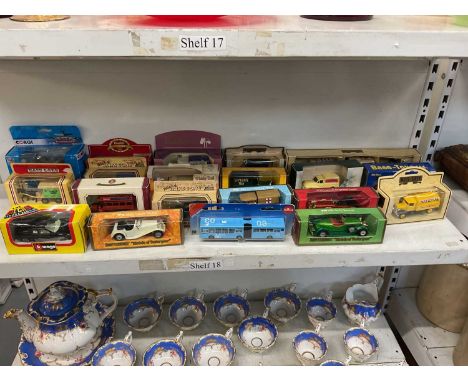 A group of approx twenty boxed model vehicles including Days Gone, Matchbox and Corgi.
