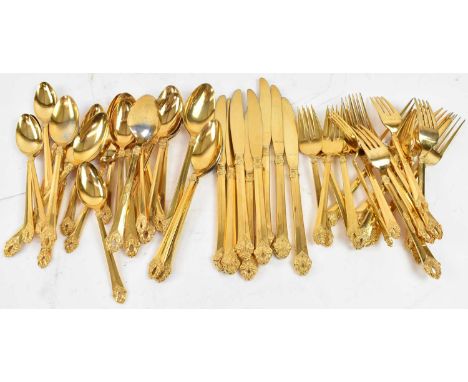 A set of silver and gilt plated cutlery, comprising eight forks, eight knives, eight dessert forks, seven tablespoons and six