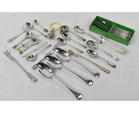 A small quantity of silver plated items to include a baby teether, teaspoons and stainless steel cutlery.