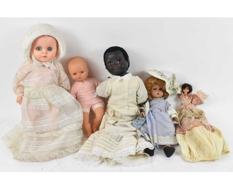 Five assorted vintage dolls.