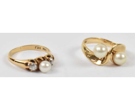 A 14ct yellow gold crossover ring set with two pearls, and a 14ct pearl and diamond three stone ring, both size K, combined a