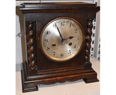 A Victorian oak mantel clock with barleytwist decoration, height 28cm.