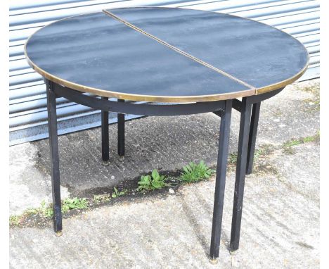 A pair of retro ebonised and brass demi-lune console tables on metal supports, width 107cm.
