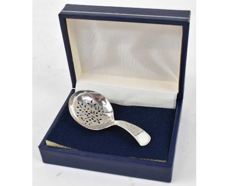 JOSEPH WILLMORE; a George II finely pierced caddy spoon of unusually small size, Birmingham 1805, length 6cm, approx 5gProven