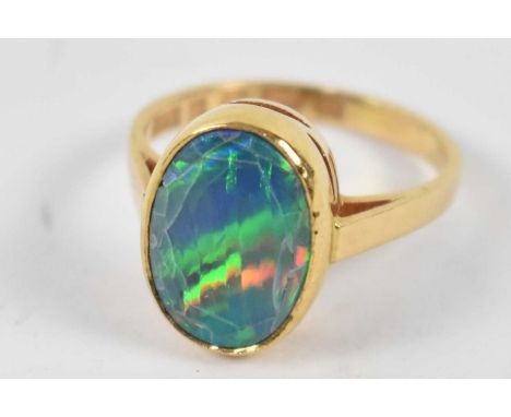 An 18ct yellow gold ring, set with fire opal (af), size L, approx. 3.6g.Condition Report: There are small cracks and one smal