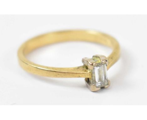 An 18ct yellow gold emerald cut diamond ring, size J/K, approx 2.3g.