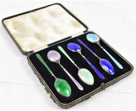 DEAKIN &amp; FRANCIS; a cased set of six George V hallmark silver and enamel coffee spoons, Birmingham 1934.Condition Report: