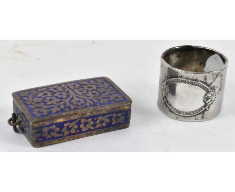 An Eastern brass and blue enamel vesta case, length 6cm, and an 800 grade silver napkin ring (2).