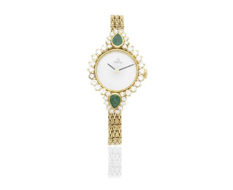 Omega. A lady's 18K gold diamond and emerald set manual wind bracelet watch with mother of pearl dialDate: Circa 1970Movement