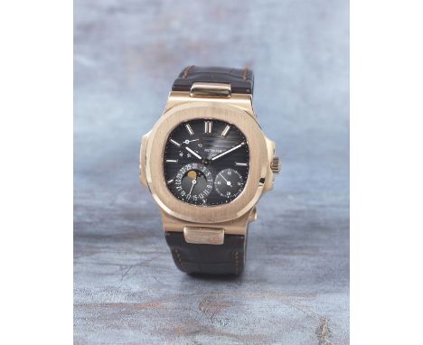 Patek Philippe. A very fine 18K rose gold automatic calendar wristwatch with moon phase and power reserveModel: NautilusRefer