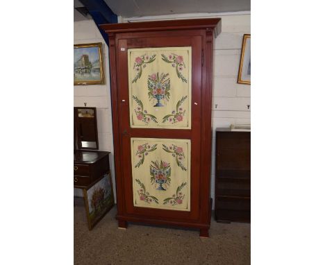 A 20th Century pine wardrobe with floral painted panels to the doors and sides