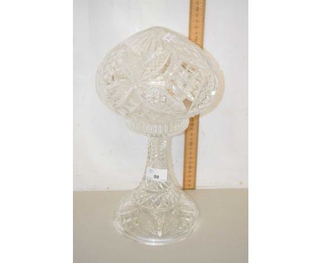 A clear glass mushroom formed lamp base