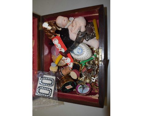 A box of various costume jewellery, miniature porcelain headed doll and various other collectables