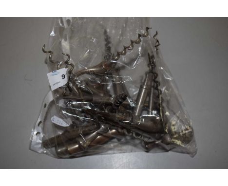 A collection of vintage metal corkscrews of T form