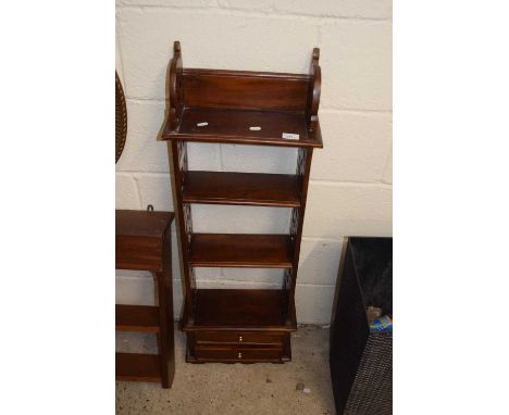A reproduction wall shelf with fretwork sides and two drawers to base