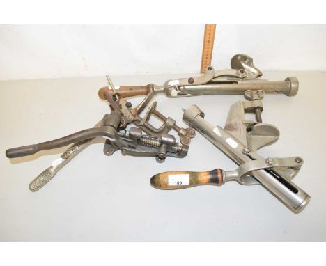 A collection of vintage bar mounted corkscrews
