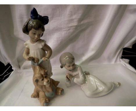 Two Nao figures, a girl with a soft toy and a girl lying down, largest H: 25cm. UK P&amp;P Group 2 (£20+VAT for the first lot