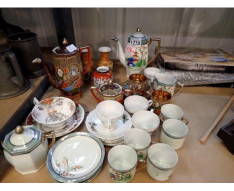 Shelf of Oriental ceramics, including coffee ware and vases. Not available for in-house P&amp;P 