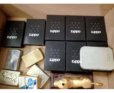 Sixteen mixed lighters to include a cased brass Zippo with paperwork, only one is a Zippo lighter. Not available for in-house