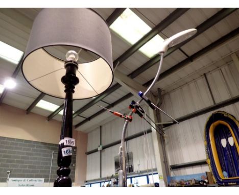 Modern black metal standard lamp with a poseable floor standing work light. All electrical items in this lot have been PAT te
