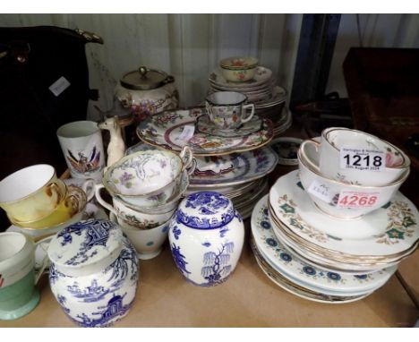 Shelf of mixed ceramics, including tea ware and blue and white ginger jars. Not available for in-house P&amp;P 