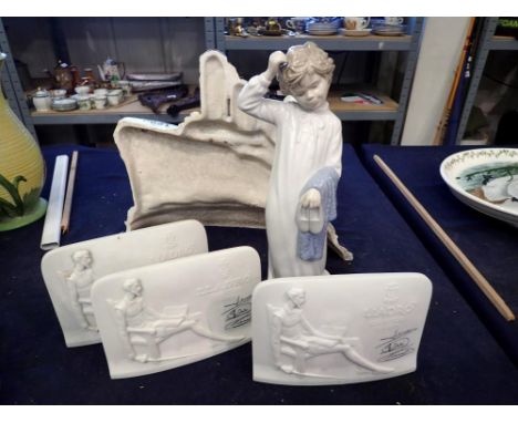 Three Lladro POS ceramic counter top signs, with a Nao figure of a boy. UK P&amp;P Group 3 (£30+VAT for the first lot and £8+