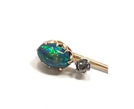 An antique 15 carat gold black opal &amp; old cut diamond stickpin, opal approx 8 x 6 mm, 2.4 inches long 