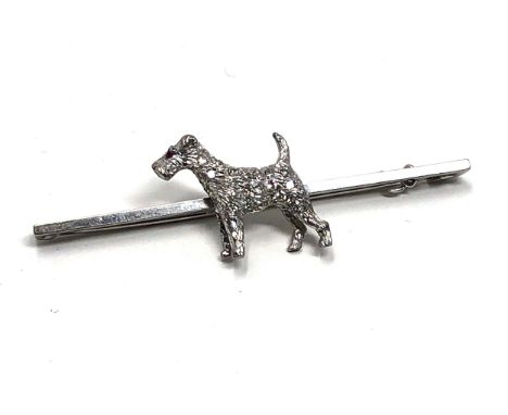 An antique 15 ct white gold &amp; 18ct white gold &amp; diamond fox terrier bar brooch;   set throughout with  white diamonds