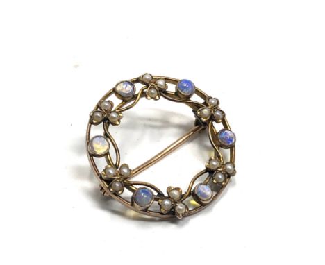 An antique 9ct gold opal &amp; seed-pearl  26 mm diameter  Approx. 3.2 grams. 