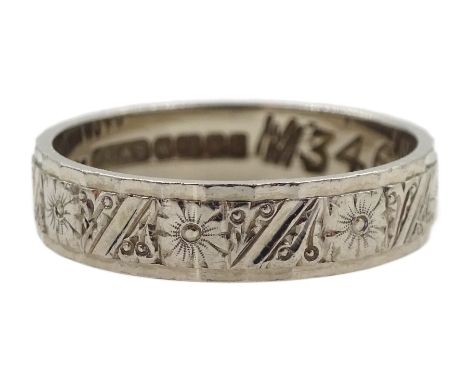 18ct white gold wedding band with engraved floral decoration, Birmingham 1966Condition Report:Approx 3.17gm, size K, depth 5m