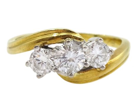 18ct gold three stone round brilliant cut diamond crossover ring, hallmarked, total diamond weight 0.75 caratCondition Report