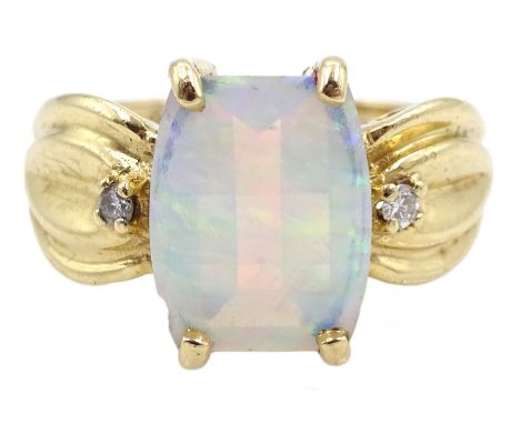 Gold three stone opal and diamond ring, stamped 10KCondition Report:Approx 4.2gm, K-L, good condition, opal = 11mm x 8mm, sma