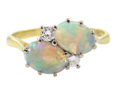 18ct gold two stone oval opal and two stone round brilliant cut diamond crossover ring, London 1981Condition Report:Approx 2.