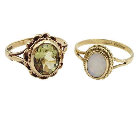 Gold single stone oval green amethyst ring and a gold single stone oval opal ring, both hallmarked 9ctCondition Report:Approx