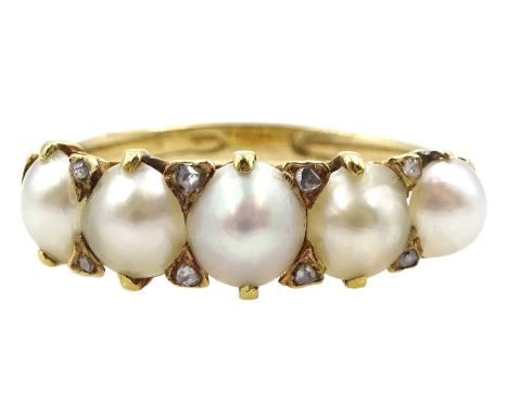 Early 20th century gold five stone split pearl ring with diamond accents set betweenCondition Report:Tests as 16ct, approx 2.