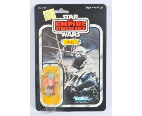 Star Wars - An original vintage 1980 Kenner made Star Wars carded MOC action figure ' Yoda '. Factory sealed upon its origina