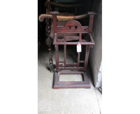 A cast iron Arts and Crafts stick stand with painted finish