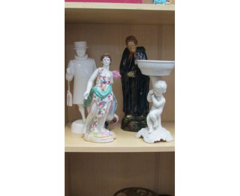 A 20th century white gloss glazed ceramic model of a Beefeater, together with a reproduction figure of Juno and the  peacock 