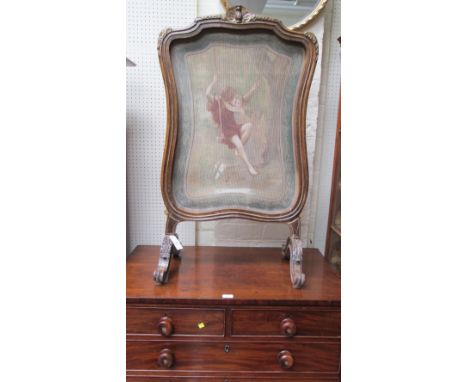A French parcel gilt walnut cartouche-form firescreen, with carved cresting and channelled outline, the central printed fabri