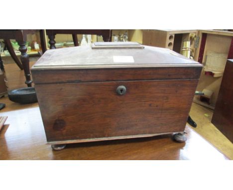 A Victorian figured rosewood sarcophagus tea caddy, with fitted interior