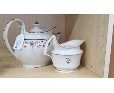 An early 19th century New Hall porcelain teapot and cover, pattern no. 434, with curved spout, high prow and loop handle, 28 